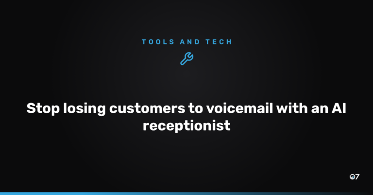 Small business owner working while an AI receptionist answers an incoming phone call